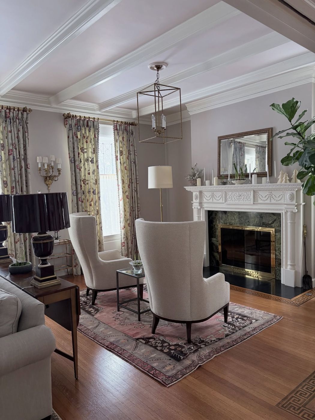 Elegant formal living room with fireplace, professionally cleaned