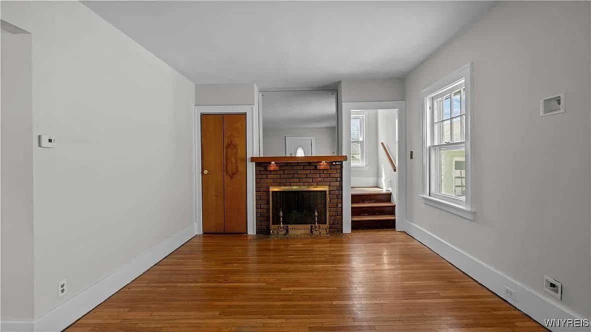 Bright living room with fireplace, freshly cleaned